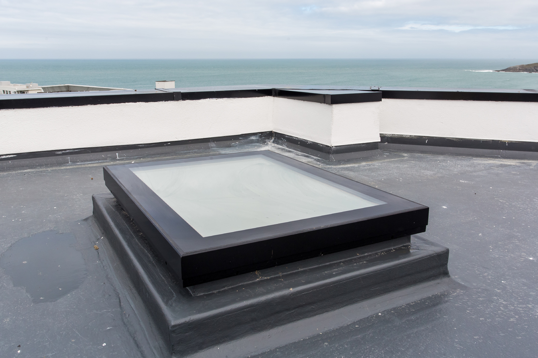 Mardome Glass Flat Roof Light powered opening for builders upstand from Omega Build