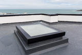 Mardome Glass Flat Roof Light powered opening for builders upstand