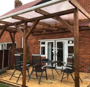 brown wood gazebo with polycarbonate roof
