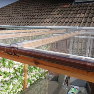 clear R glaze polycarbonate roofing panels on a wooden frame