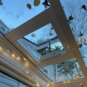 Open roof vent in a glass roof