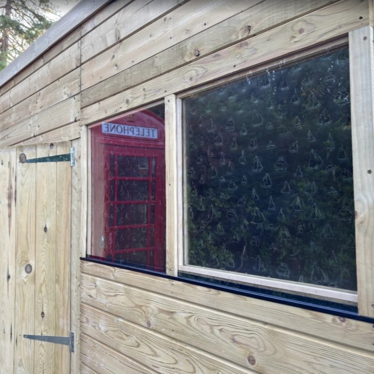 Cut-to-Size Polycarbonate Sheets protect antique glass on a Garden Shed